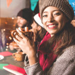 Christmas hampers you need on your wishlist - lady holding mug of hot cider